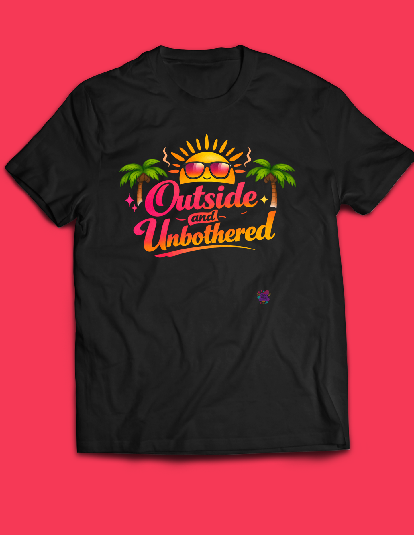 Black outside and unbothered tshirt on coral back ground. Tshirt features sun with sunglasses and palm trees